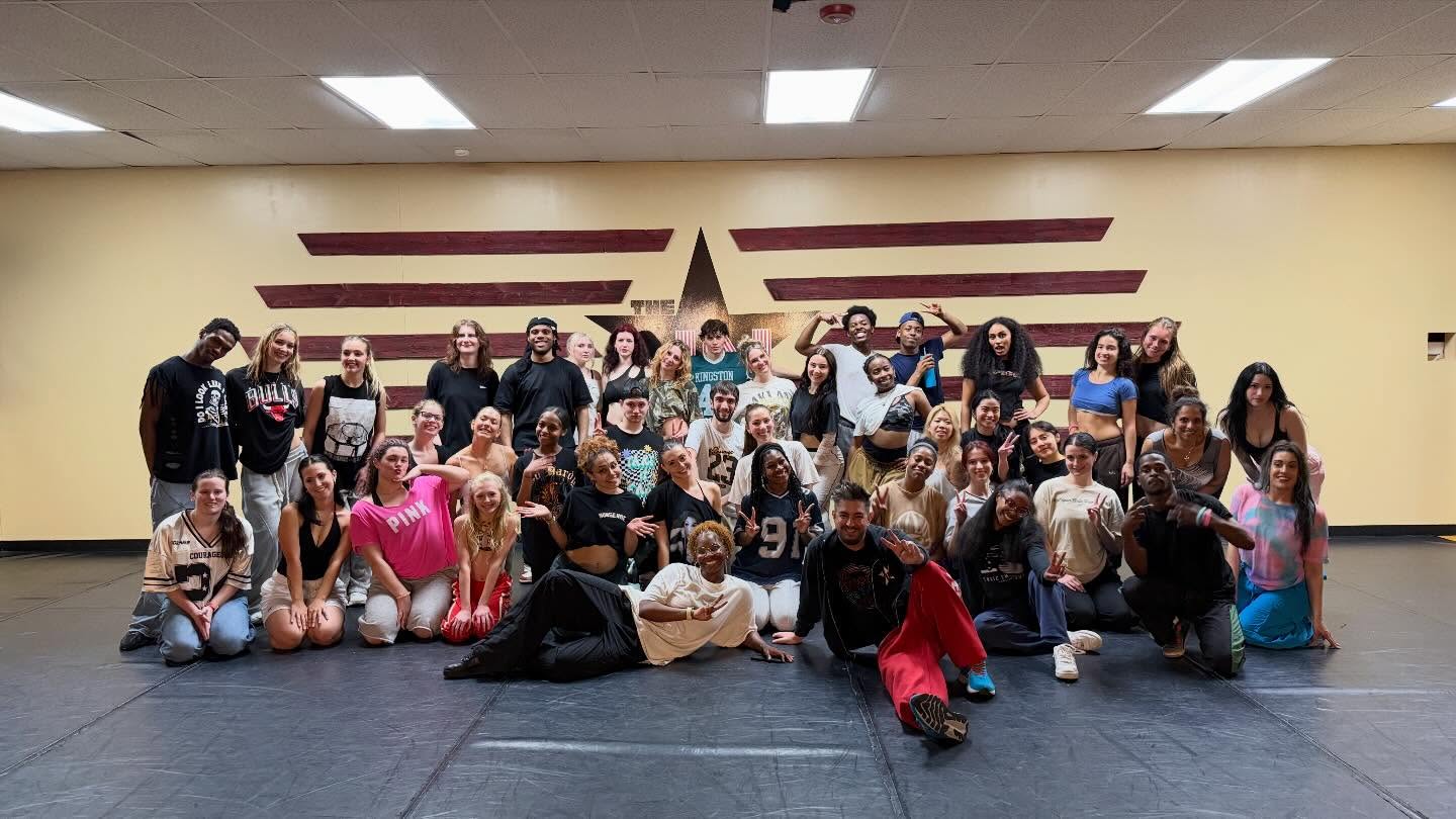 Members of the INstitute of Dancers together inside the Okemos studio